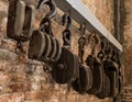 Wooden pulleys in a row Royalty Free Stock Photo