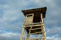 Wooden pulpit for hunters and sky