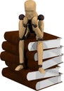 Wooden puppet with books Royalty Free Stock Photo