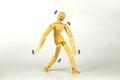 The wooden puppet exhibits abnormal gait, staggering, hangover Royalty Free Stock Photo