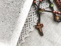 Old rosary and ash - symbols of Ash Wednesday. Canvas background. Top view. Royalty Free Stock Photo