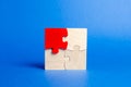 Wooden puzzles on a blue background. One puzzle is different. Individual opinion. Stand out from the crowd. Uniqueness. Divergent Royalty Free Stock Photo