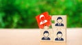 Wooden puzzles with the image of workers. The concept of personnel management in the company. Dismissing an employees from a team Royalty Free Stock Photo