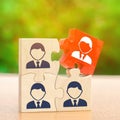 Wooden puzzles with the image of workers. The concept of personnel management in the company. Dismissing an employees from a team Royalty Free Stock Photo