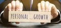 Wooden puzzles with the word Personal growth in the hands of a businessman. Self-improvement of skills, knowledge, personal Royalty Free Stock Photo