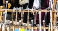 A wooden rack with several medieval weapons