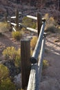 Wooden rail fence in desert landscape Royalty Free Stock Photo