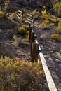 Wooden rail fence in desert landscape Royalty Free Stock Photo