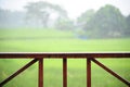 Wooden rail of hose terrace in raining