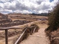 Wooden railing and dirt road