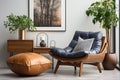 Wooden recliner chair with blue leather cushion near cabinet and side table against white wall with poster frame. Scandinavian or