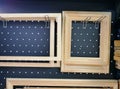 Wooden rectangular picture frames on a metal hook on the showcase. accessories for artists. making pictures. handmade products mad
