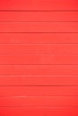 Wooden red background with horizontal planks. Empty surface, close up view.