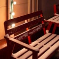 Wooden red bench and a table at outdoor cafe covered with snow in the winter Royalty Free Stock Photo