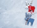 Wooden red, blue deer on the grunge gray background. Christmas and New year decoration concept. flat lay Royalty Free Stock Photo