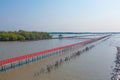 Wooden Red Bridge at Samut Sakhon, Thailand. Tourist attraction landmark with ocean sea bay. Travelling in holiday vacation Royalty Free Stock Photo