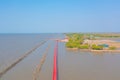 Wooden Red Bridge at Samut Sakhon, Thailand. Tourist attraction landmark with ocean sea bay. Travelling in holiday vacation Royalty Free Stock Photo