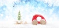 Wooden Red Car Pulling Sled with Christmas Ball and Christmas Tree on Snowy Background Royalty Free Stock Photo