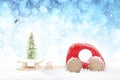 Wooden Red Car Pulling Sled with Christmas Ball and Christmas Tree on Snowy Background Royalty Free Stock Photo