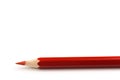 Wooden red pencil isolated on a white background, close ap Royalty Free Stock Photo