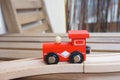 Wooden red toy train on wooden tracks Royalty Free Stock Photo