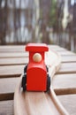 Wooden red toy train on wooden tracks Royalty Free Stock Photo