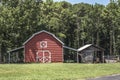 A wooden red and white old barn in the country on a farm Royalty Free Stock Photo