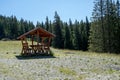 Wooden refuge on a mountain road to Pietrele Doamnei mountain Lady`s stones cliff. Rarau mountains in Bucovina, Romania