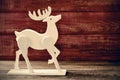 Wooden reindeer on a rustic wooden surface