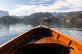 Wooden rent boat on a Bled lake, end of the boat facing towards Lake Bled island with copy space- famous tourist