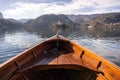 Wooden rent boat, end of the boat facing towards Lake Bled island - copy space and focus on boat, tourist destination in