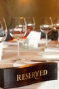 Wooden reserved plate on restaurant table