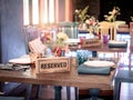 Wooden reserved sign on dining table in restaurant