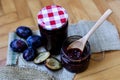 Vintage Charm: Wooden Spoon in Plum Jam Jar Royalty Free Stock Photo