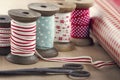 Wooden ribbon spools, paper rolls and old scissors