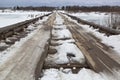 Wooden road bridge across river Vaga near the village Klopovskaya Royalty Free Stock Photo