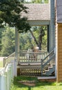 Wooden rocking chair on porch of old house Royalty Free Stock Photo