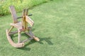 Wooden rocking horse chair children on lawn Royalty Free Stock Photo