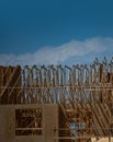 Wooden roof building. Standard timber framed building with roof trusses. Roof Frame house. The frame of the new build Royalty Free Stock Photo