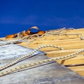 Wooden roof construction and Equipment for work at height, symbolic photo for home, house building Equipment for work at height Royalty Free Stock Photo