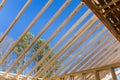 A wooden roof framework was constructed from trusses during the construction of a new beam stick home