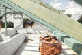 Wooden roof framing. Unfinished roof trusses and aerated concrete block walls, view in attic with rafters and beams. Modern