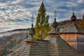 Wooden roof with three towers with Slovak crosses of church in Korejovce during autumn Royalty Free Stock Photo