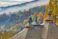 Wooden roof with three towers with Slovak crosses of church in Korejovce during autumn Royalty Free Stock Photo