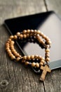 Wooden rosary beads with computer tablet Royalty Free Stock Photo