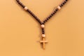 Wooden rosary beads with cross, top view. Christian concept Royalty Free Stock Photo