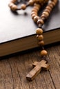 Wooden rosary beads and holy bible Royalty Free Stock Photo