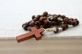 Wooden rosary on bible