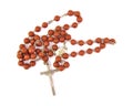 Wooden rosary with a cross on white background Royalty Free Stock Photo