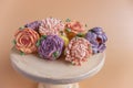 On wooden round background lie natural marshmallows in the form of flowers. Sweet desserts sugarless Royalty Free Stock Photo
